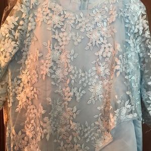 This is a beautiful periwinkle blue lace dress.